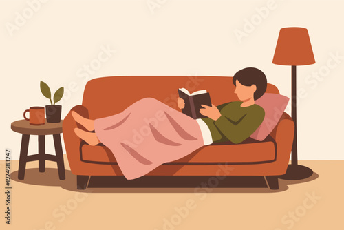 Woman relaxing on sofa reading a book, enjoying cozy hygge lifestyle at home