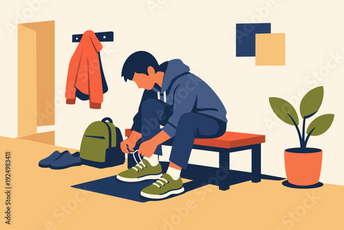 Young man preparing for his day, tying shoelaces on sneakers in a hallway