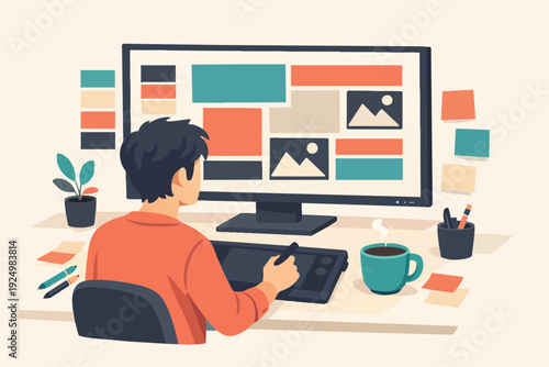 Creative designer working on graphic project using computer and digital pen tablet