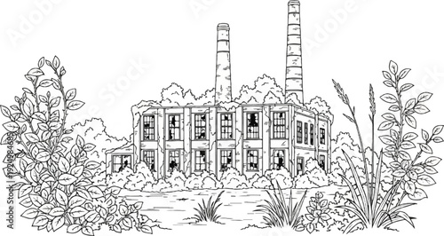 Dilapidated factory building with two smokestacks surrounded by overgrowth