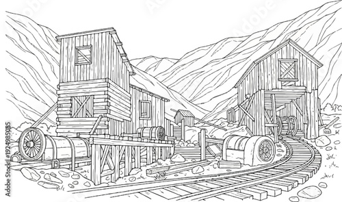 Old wooden mine structures and railway tracks in a mountain landscape