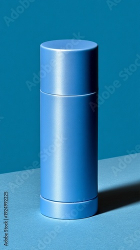Solid blue deodorant stick on a seamless, powder blue backdrop. The surface is smooth and clean, reflecting light subtly