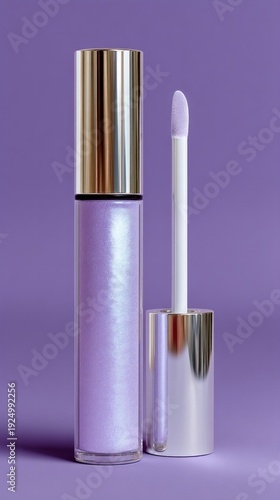 Sparkling lavender lip gloss tube alongside applicator on a light lavender backdrop, showcasing elegance and beauty