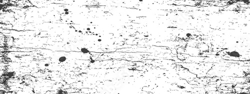 Distressed grunge texture background with ink splatters and cracks in black and white