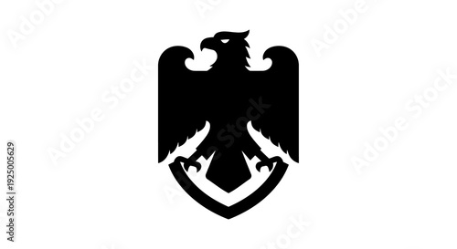 A black eagle emblem with outstretched wings on a white shield
