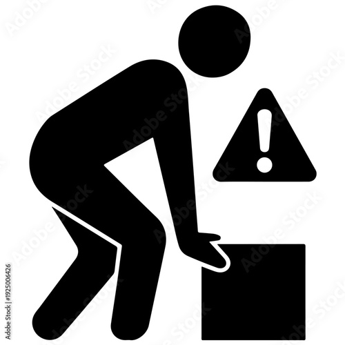 A person bending to pick up a box with a warning sign