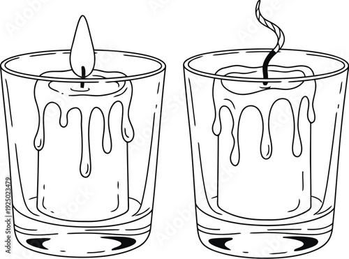 Two lit candles melting wax inside clear glass tumblers