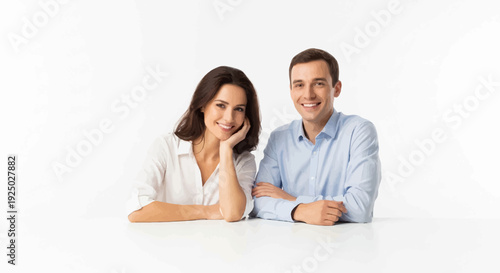 Happy couple sitting together at a table, both smiling