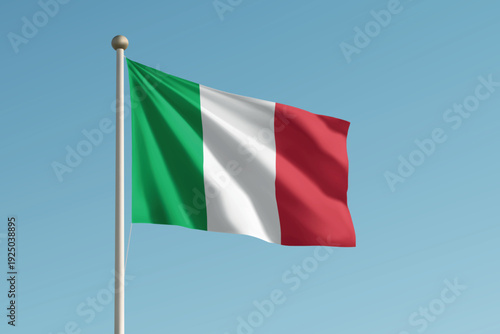Italy national flag waving on pole against clear blue sky background.