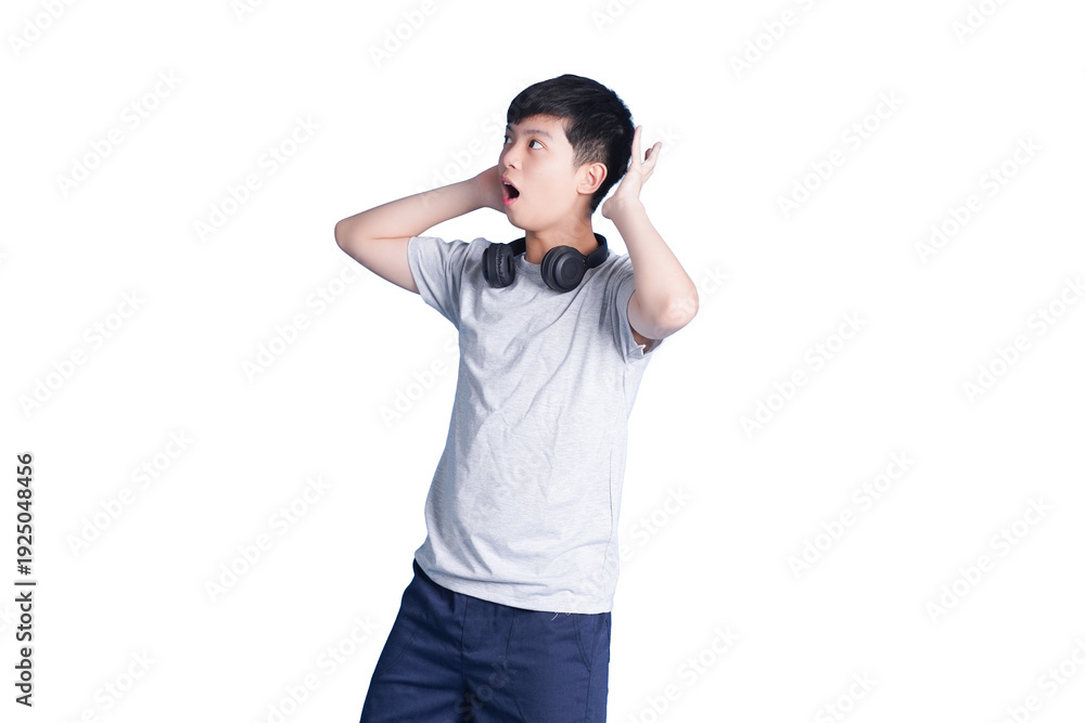 Fototapeta premium Startled Expression: A young individual, overwhelmed by a surprising event, covers their ears, capturing a moment of shock and disbelief. 