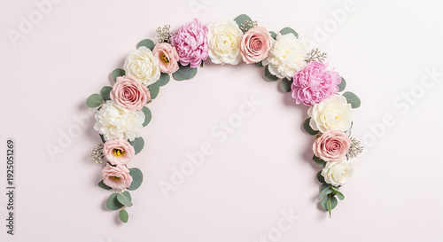 A serene floral archway featuring roses and carnations arranged in a semicircular pattern