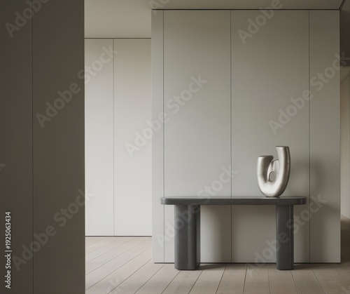 Minimalist hallway with console table and abstract sculpture.