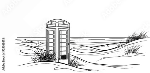 Iconic red telephone box stands amidst windswept dunes by the sea