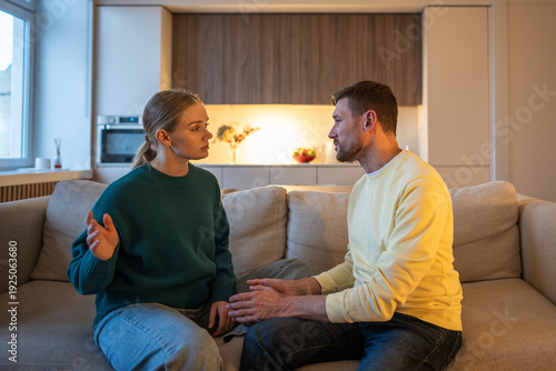 Obraz na płótnie Frustrated wife fed up with manipulative lies about cheating affair from guilty husband, couple having argument at home, marriage crisis and toxic relationships, family in quarrel over betrayal
