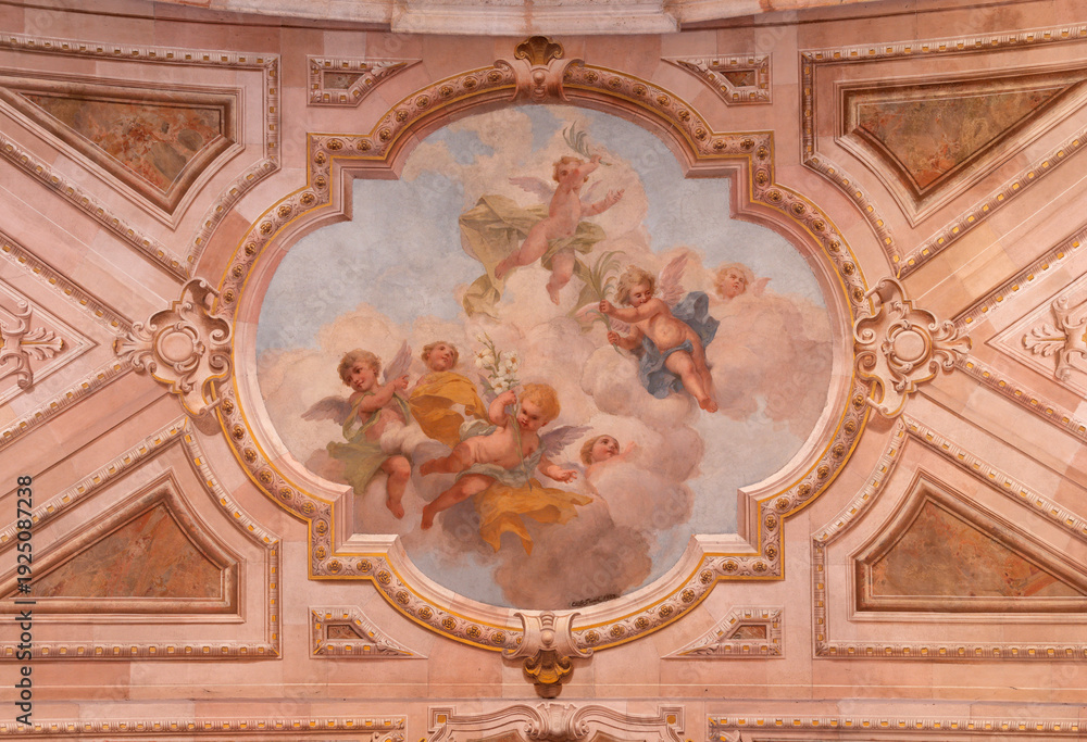 Naklejka premium BUSTO ARSIZIO, ITALY - JANUARY 19, 2026: The fresco of angels with symbols of martyrdom in the church Basilica di San GIovanni Battista by Carlo Grossi (1907)