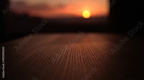 Sunset Reflection on Rustic Wooden Table Surface