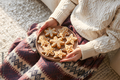 Woman holding plate of star shaped cookies
