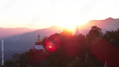 Cinematic sunset view of mountain Buddhist temple on mountain top