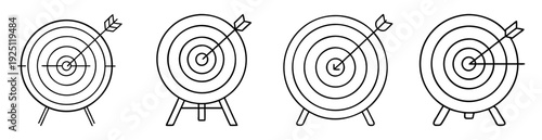 Four black and white bullseye targets with arrows in the center