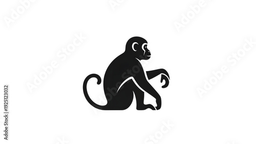 Monkey sitting in relaxed pose with curled tail