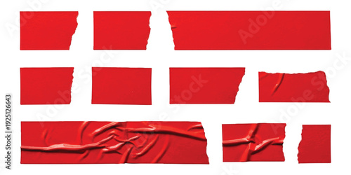 Collection of torn red adhesive tape pieces arranged on a clean white background
