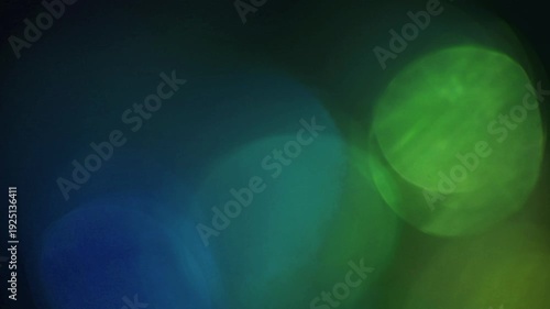 light leak and bokeh overlay with blue and green tones, ideal for adding atmospheric effects to video projects. This visual element enhances mood and transitions.