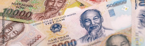 Vietnamese dong money bills pile on table. Vietnam banknotes of VND currency close up.