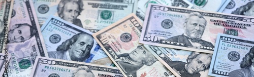 Wallpaper Mural US dollar money bills pile on table. United States banknotes of USD currency close up. Torontodigital.ca