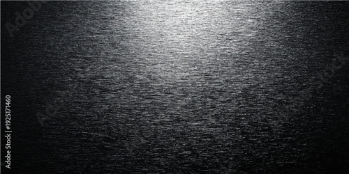 Textured Darkness: An evocative and tactile composition featuring a rough, grainy surface with a captivating play of light and shadow, revealing depth and visual interest.