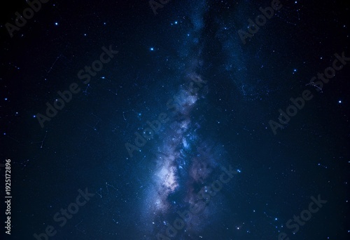 A stunning representation of the Milky Way galaxy, showcasing bright stars against a deep blue and black backdrop of space.