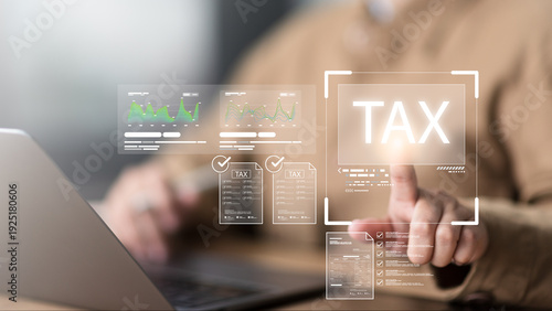 Foto Business accounting management uses laptop showing tax filing checklist