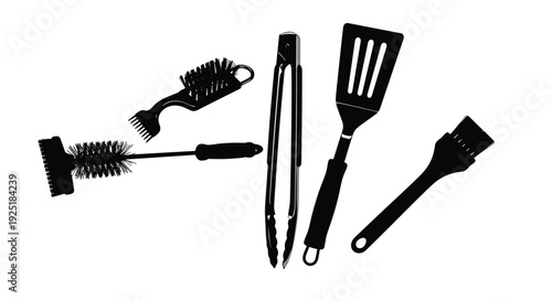 Collection of black silhouette barbecue grilling tools on a white background