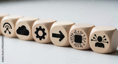 Wooden cubes with digital transformation symbols aligned manually with controlled focus and minimal lightly blurred background.