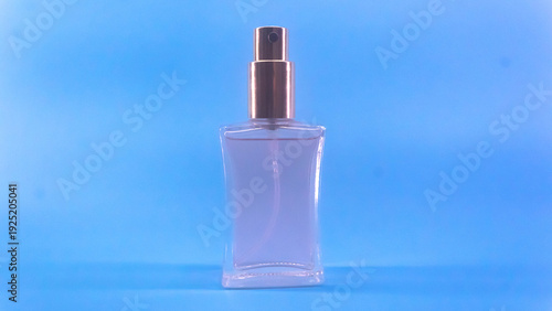 Perfume bottle on Blue Background