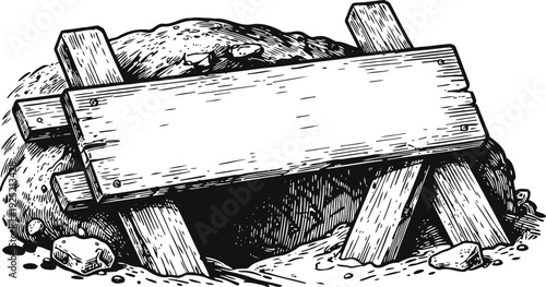 Old wooden signboard placed over a cave entrance with stones and dirt surrounding it