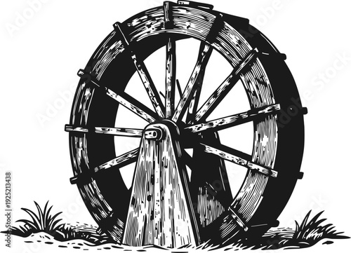 Vintage wooden water wheel rotating in nature with grass and old support structure