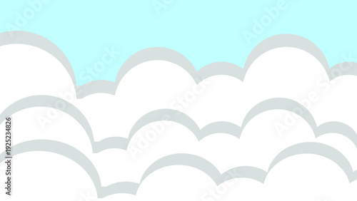 Soft, fluffy white clouds drift across a clear blue sky on a bright, sunny day, evoking a sense of peace and serenity