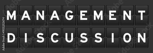 Black color analog flip board with word management discussion on gray background