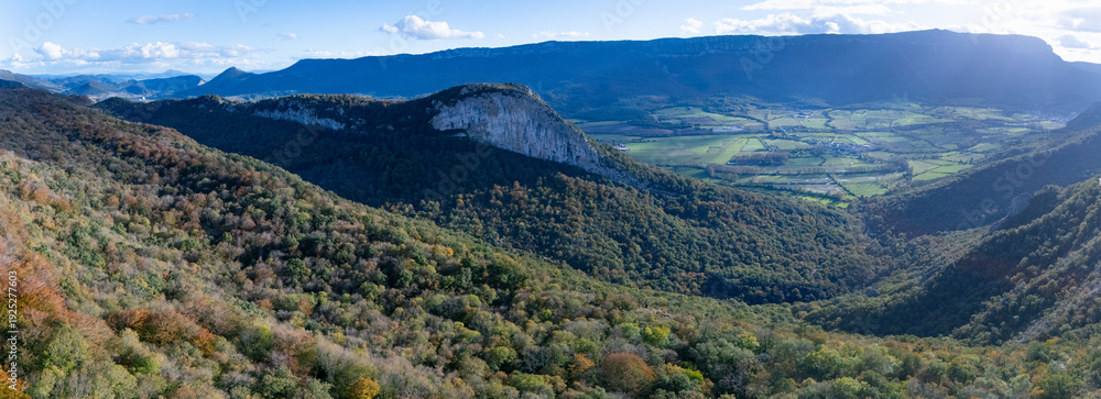 Fototapeta premium Aerial drone view of the autumn landscape surrounding the beech forest and the Sanctuary of San Miguel de Excelsis in the Sierra de Aralar. Huarte-Araquil, Navarre, Spain, Europe
