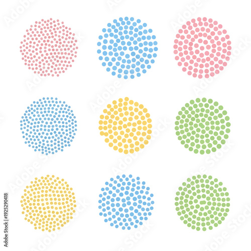 A 3x3 grid of colorful circular patterns with varying designs on a plain surface from a direct viewpoint