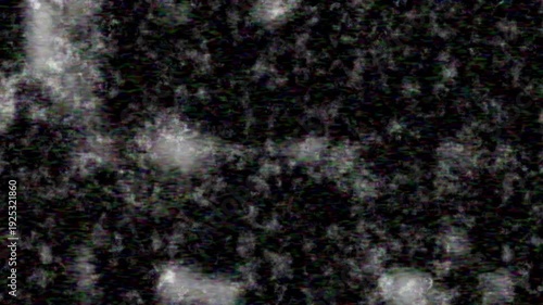 Dynamic video of a dark, grunge texture with shimmering abstract light particles and digital static, perfect for modern and futuristic visuals.