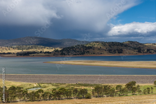 Wallpaper Mural Aerial view of heavy rain falling from storm clouds over an inland reservoir and distant mountain Torontodigital.ca