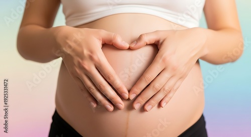 Wallpaper Mural Pregnant woman forming a heart shape with her hands on her belly Torontodigital.ca