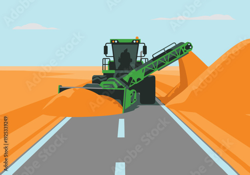 A large construction machine clears sand from a highway, creating a smooth road. Bright colors and a clear composition make this image ideal for commercial use.