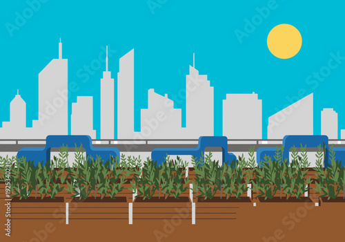 A vibrant urban garden hub showcases a community garden integrated with city skyscrapers. Lush greenery and blue seating create a tranquil space. Perfect for lifestyle and urban design visuals.