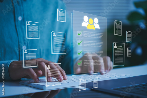 Photos Digital recruitment platform interface with candidate profiles on virtual screen HR manager typing on laptop to streamline talent acquisition resume screening and online hiring process