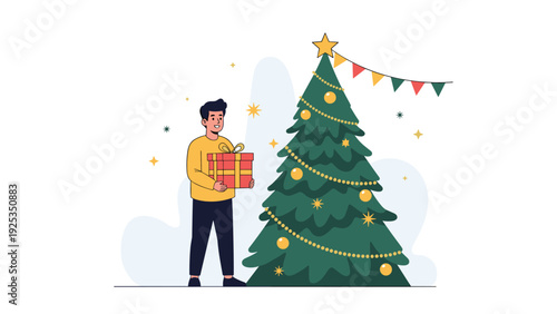 Young man standing next to a beautifully decorated Christmas tree, holding a large gift box, ready for the holiday celebration.