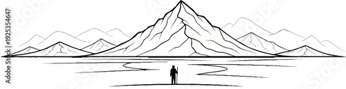 Lone traveler stands before a vast mountain range under a clear sky