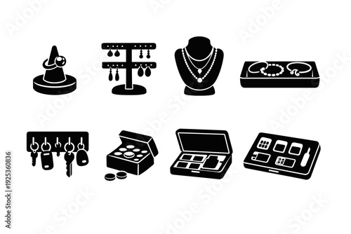 Various jewelry and accessories displayed with key holders and makeup boxes