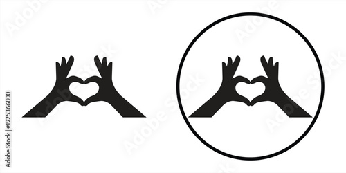 Silhouette of two hands forming a heart shape gesture of love and affection.